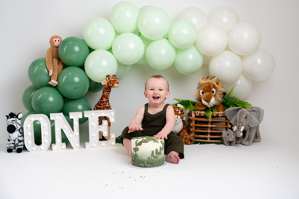 safari jungle cake smash theme boy green and white balloons 